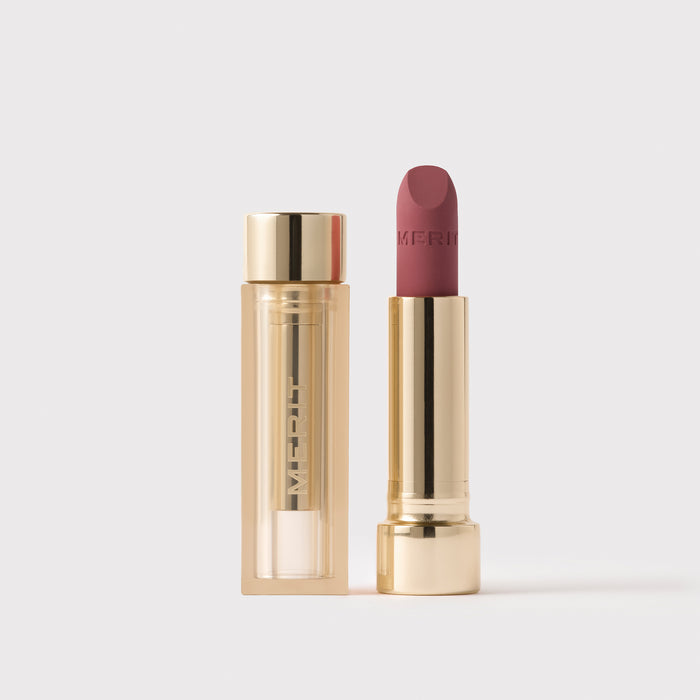 Master || Signature Lip Blush in Archival next to its case.