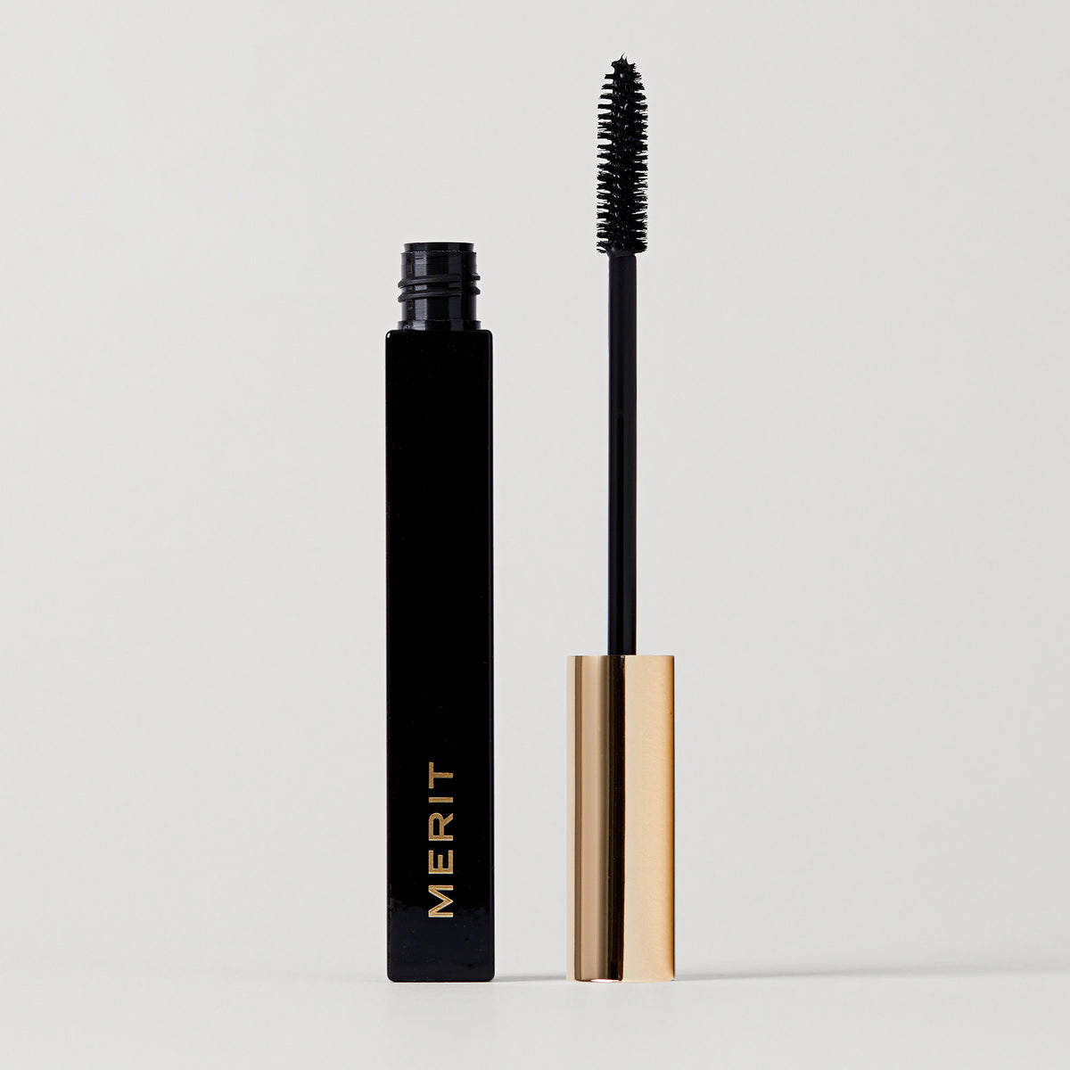 Master || Clean Lash Mascara wand with black mascara is shown alongside a mascara tube that has won an Allure Best of Beauty Award in 2021.
