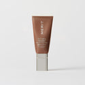 Master || A tube of MERIT brand mineral sunscreen with a sheer tint finish, providing broad spectrum 50 UVA/UVB protection, displayed against a white background. Shade 04