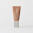 Master || A tube of MERIT brand mineral sunscreen with a sheer tint finish, providing broad spectrum 50 UVA/UVB protection, displayed against a white background.
Shade 10