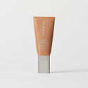 Master || A tube of MERIT brand mineral sunscreen with a sheer tint finish, providing broad spectrum 50 UVA/UVB protection, displayed against a white background. Shade 12