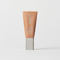 Master || A tube of MERIT brand mineral sunscreen with a sheer tint finish, providing broad spectrum 50 UVA/UVB protection, displayed against a white background. Shade 16 