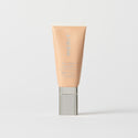 Master || A tube of MERIT brand mineral sunscreen with a sheer tint finish, providing broad spectrum 50 UVA/UVB protection, displayed against a white background. Shade 28