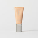 Master || A tube of MERIT brand mineral sunscreen with a sheer tint finish, providing broad spectrum 45 UVA/UVB protection, displayed against a white background. Shade 28