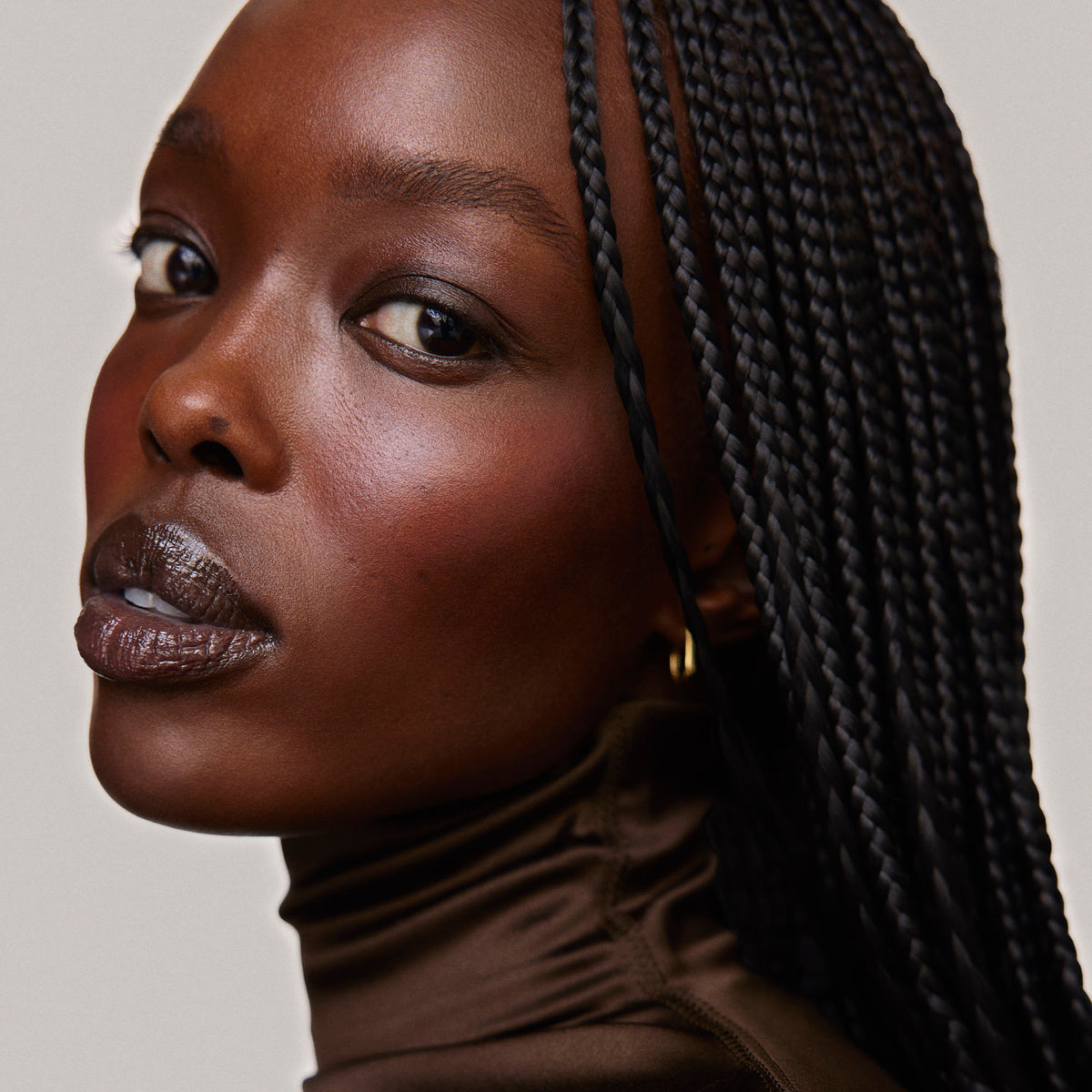 Fox | face::rich | Model is wearing Flush Balm in shade Fox.