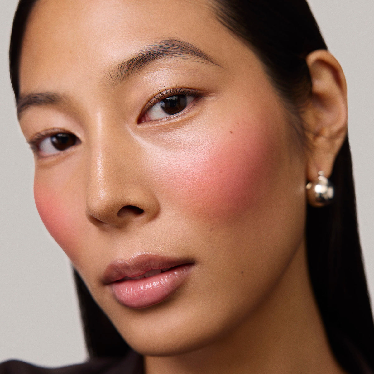 Master || Model is wearing Flush Balm in shade Le Bonbon.