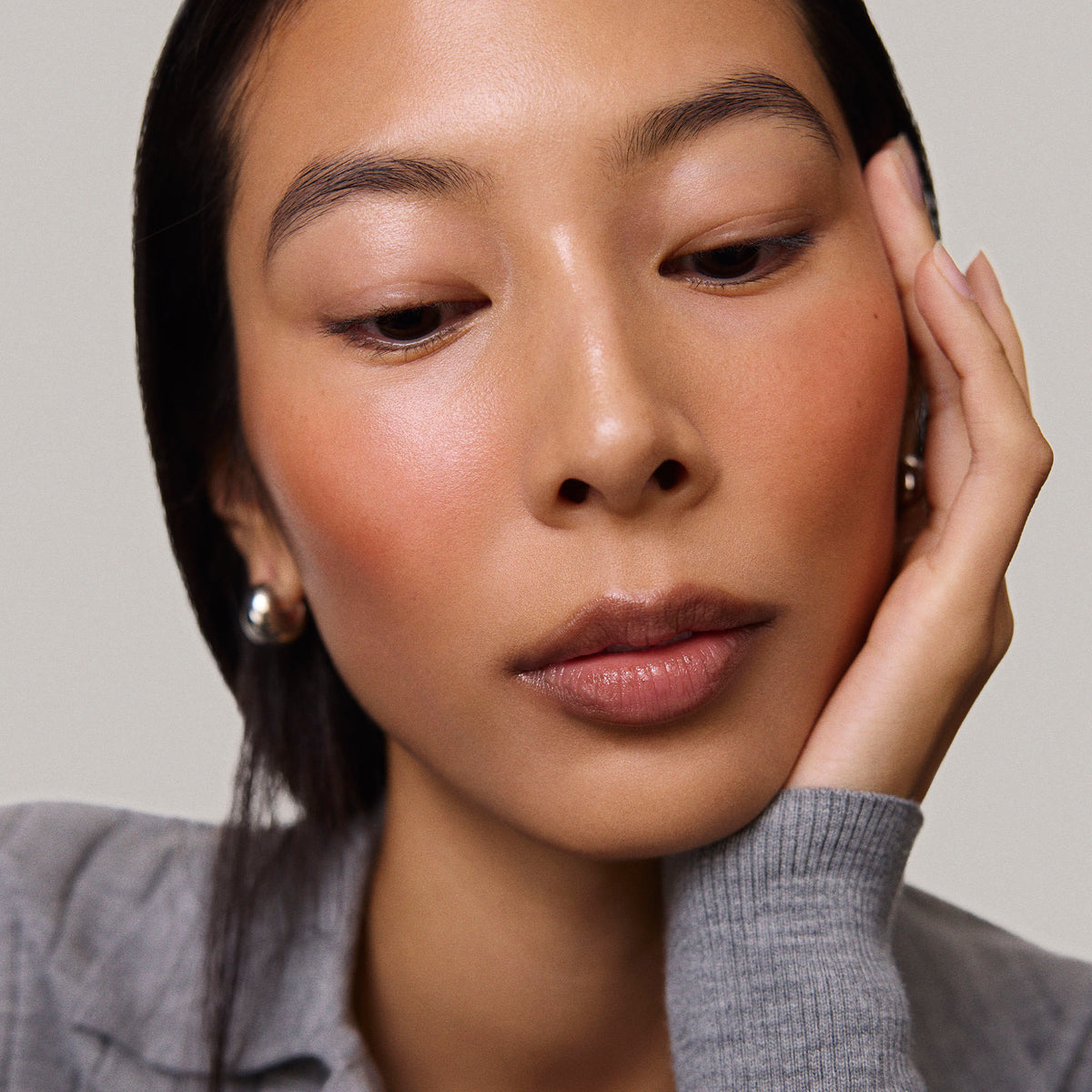 Master || Model is wearing Flush Balm in shade Terracotta.
