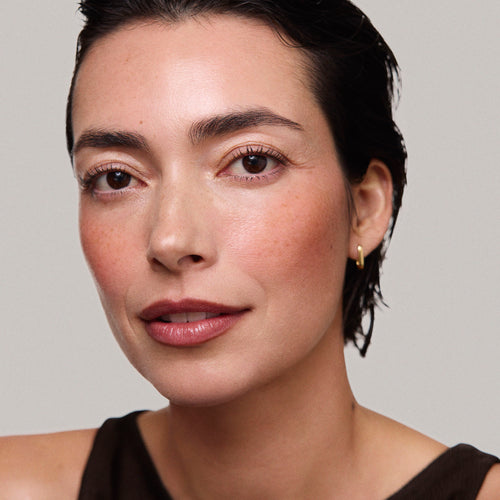 Master || Model is wearing Flush Balm in shade Terracotta.