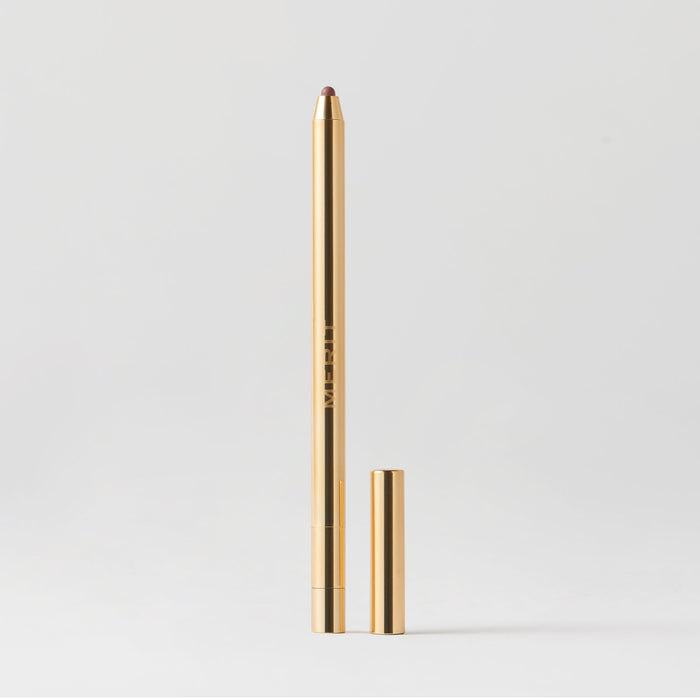 Master || A gold-colored lip liner pencil with its cap removed, displayed against a white background.