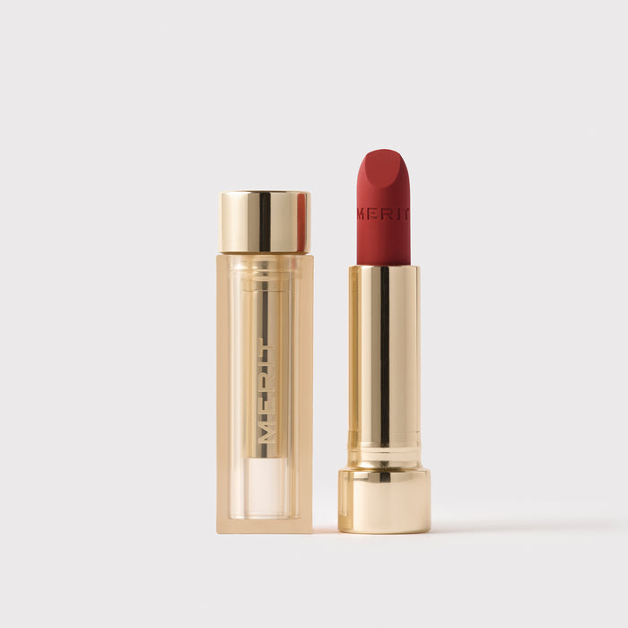 Master || Signature Lip Blush open with case next to it.