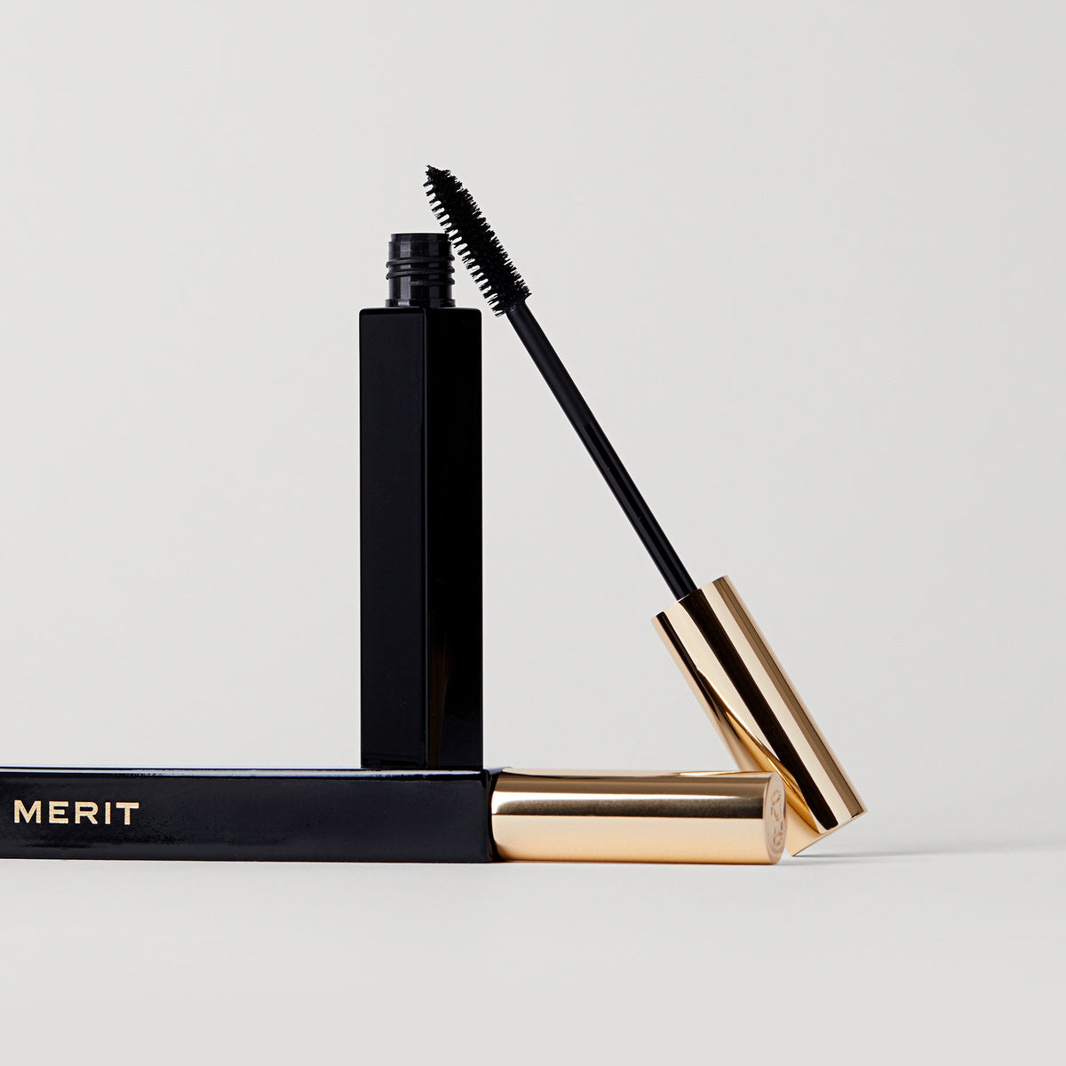 Master | | Two tubes of Clean Lash, one open and standing, the other laying down 